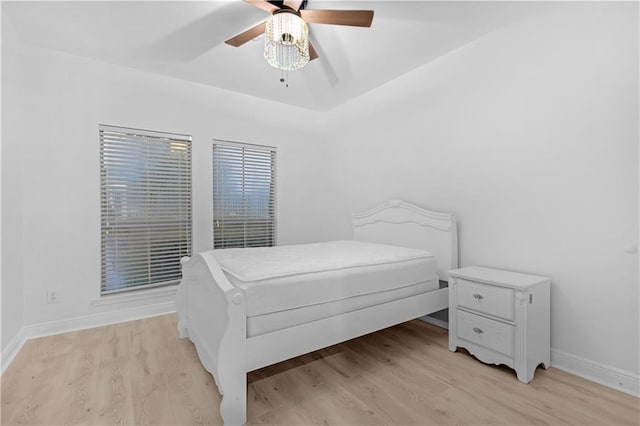 bedroom featuring light wood-type flooring and ceiling fan