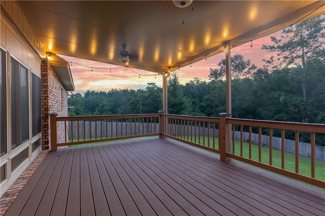 deck at dusk with a yard