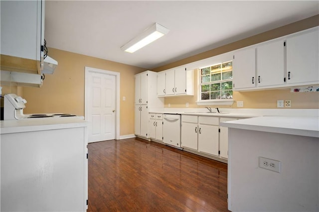 9996 Wedgefield Ct, Mobile, AL 36608 - kitchen with white dishwasher, stove, white cabinetry, dark wood-style flooring, and light countertops