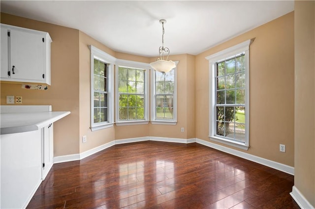 9996 Wedgefield Ct, Mobile, AL 36608 - unfurnished dining area featuring dark wood-style flooring and baseboards