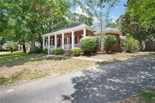9996 Wedgefield Ct, Mobile, AL 36608 - ranch-style home featuring a porch and brick siding
