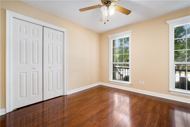 9996 Wedgefield Ct, Mobile, AL 36608 - unfurnished bedroom featuring multiple windows, hardwood / wood-style floors, a closet, and ceiling fan