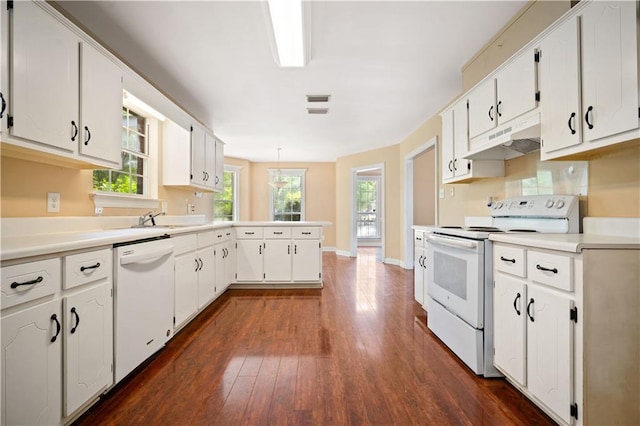 9996 Wedgefield Ct, Mobile, AL 36608 - kitchen featuring white appliances, a peninsula, dark wood-type flooring, under cabinet range hood, and white cabinetry