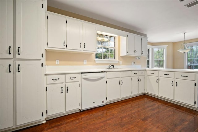 9996 Wedgefield Ct, Mobile, AL 36608 - kitchen featuring white dishwasher, dark wood-style flooring, and white cabinetry
