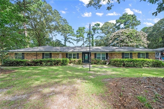 ranch-style house with brick siding and a front yard