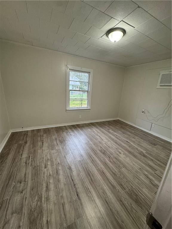 spare room featuring dark hardwood / wood-style flooring