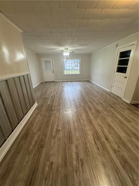 unfurnished room with ceiling fan and hardwood / wood-style floors