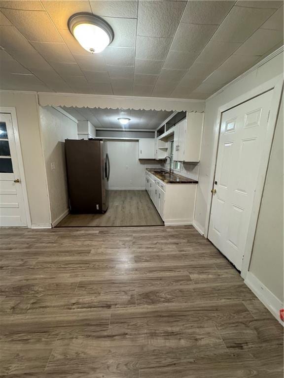 washroom with hardwood / wood-style floors and sink