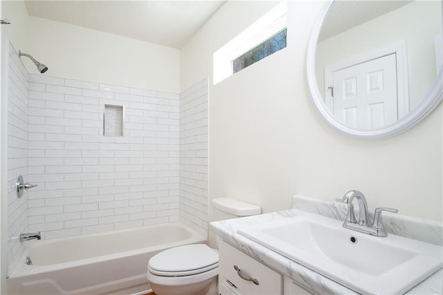 bathroom with vanity, shower / tub combination, and toilet