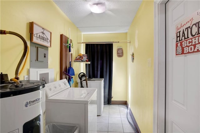 5023 Freeway Ln, Mobile, AL 36619 - washroom with washer and dryer, light tile patterned floors, electric water heater, and a textured ceiling
