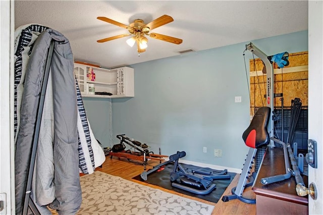 5023 Freeway Ln, Mobile, AL 36619 - workout room with ceiling fan and wood-type flooring