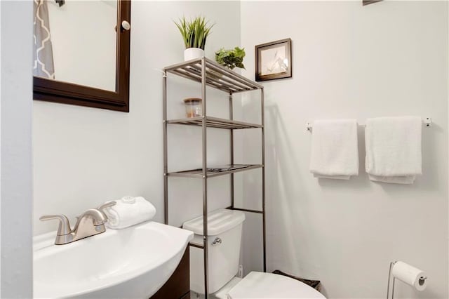5023 Freeway Ln, Mobile, AL 36619 - bathroom featuring toilet and sink
