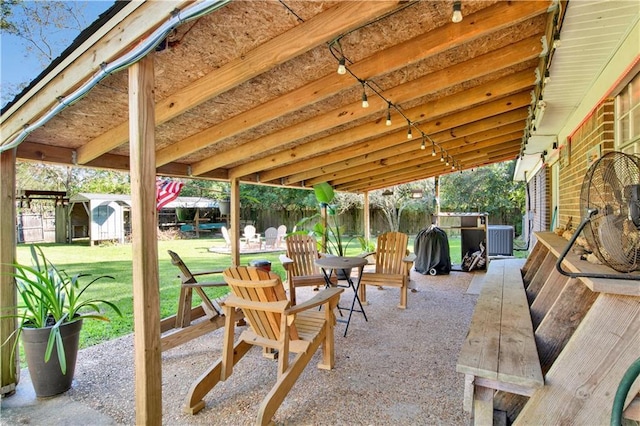 5023 Freeway Ln, Mobile, AL 36619 - view of patio / terrace featuring a shed and central air condition unit