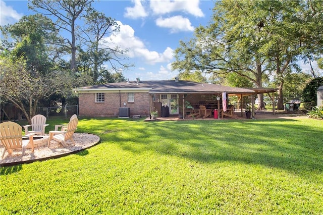 5023 Freeway Ln, Mobile, AL 36619 - rear view of property featuring central AC and a yard