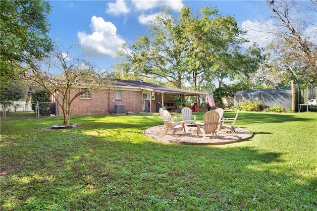 5023 Freeway Ln, Mobile, AL 36619 - view of yard featuring central AC unit and an outdoor fire pit