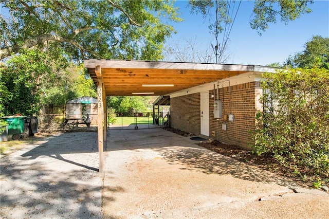 5023 Freeway Ln, Mobile, AL 36619 - view of parking / parking lot with a carport