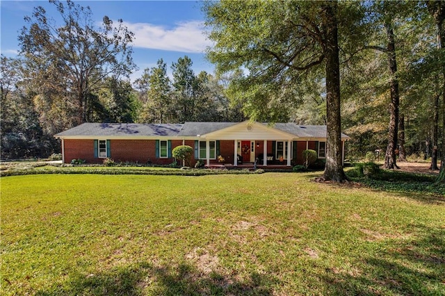 ranch-style house with a front lawn