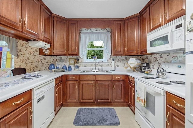 kitchen with white appliances and sink