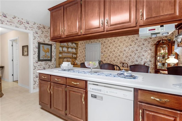 kitchen featuring dishwasher and kitchen peninsula