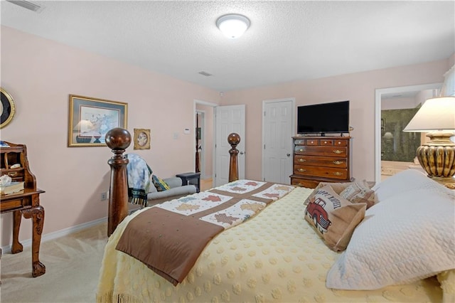 carpeted bedroom with a textured ceiling