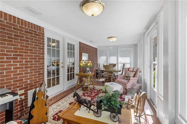 sunroom featuring french doors