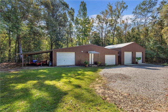 garage with a lawn and a carport