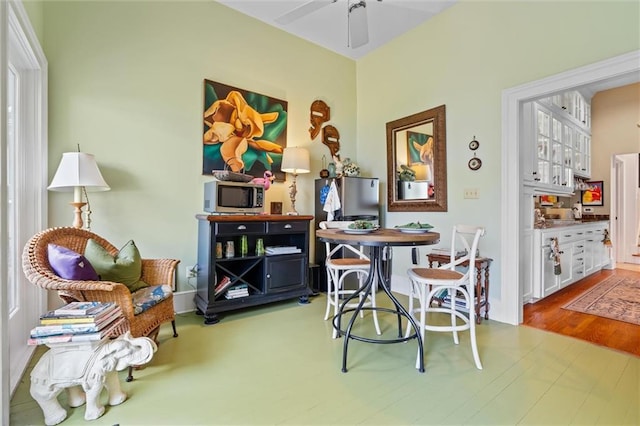 dining space with hardwood / wood-style flooring