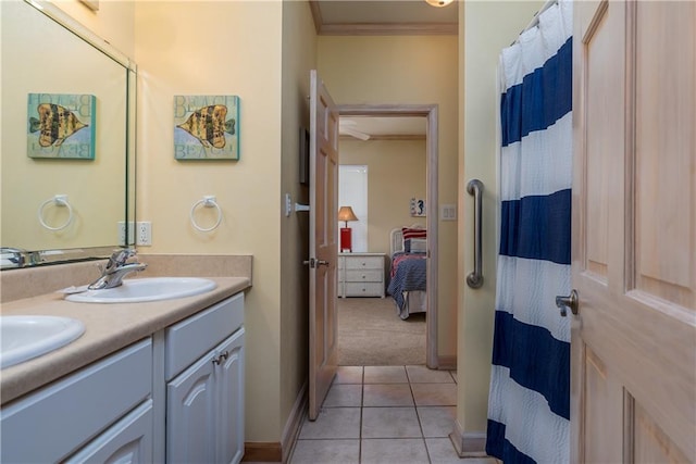 bathroom with tile patterned flooring, vanity, and ornamental molding