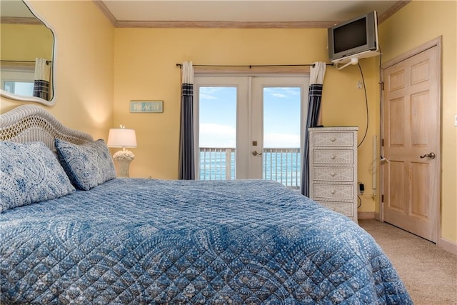 bedroom with access to exterior, french doors, light colored carpet, crown molding, and a water view