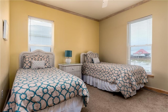 bedroom with carpet floors, multiple windows, ornamental molding, and ceiling fan