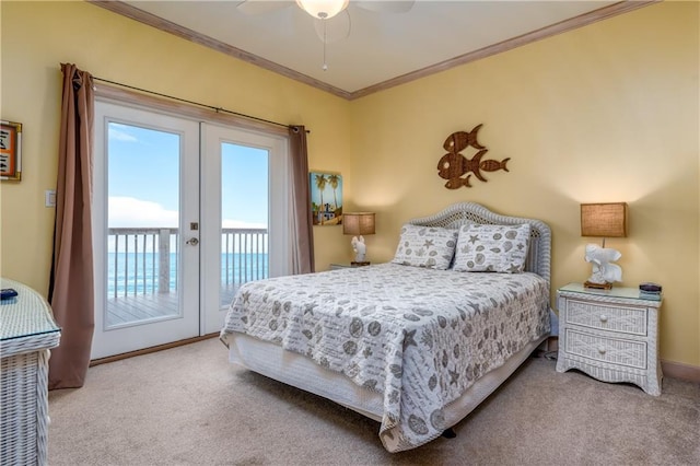 carpeted bedroom with access to outside, ceiling fan, a water view, and ornamental molding