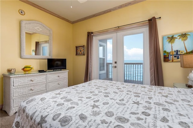 bedroom featuring access to exterior, carpet floors, and crown molding