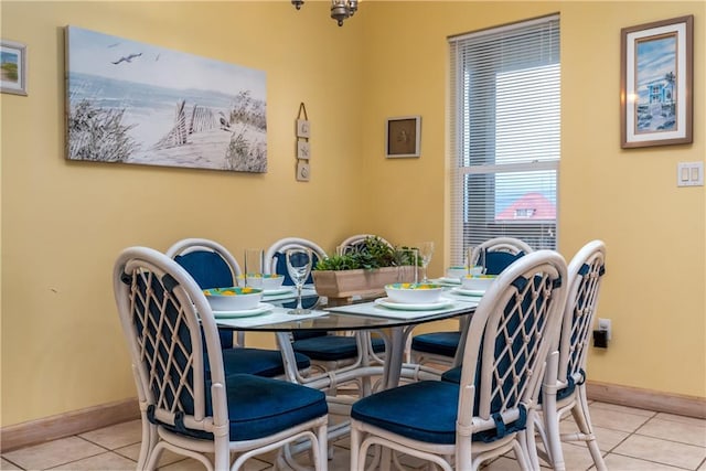 dining space featuring light tile patterned floors