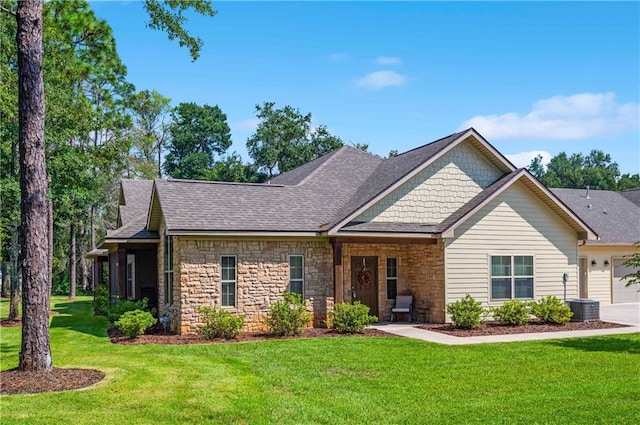 view of front of house featuring a front yard and a garage