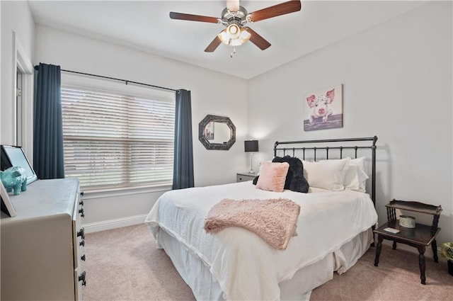 bedroom featuring ceiling fan and light colored carpet