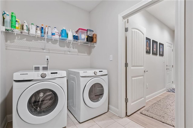 laundry area featuring light wood-type flooring and washer and dryer