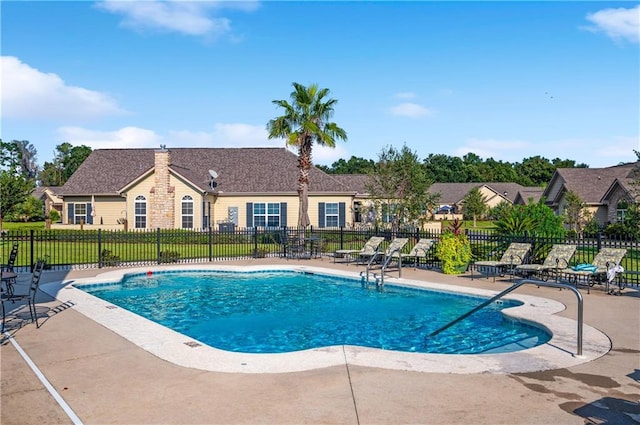 view of swimming pool with a patio area