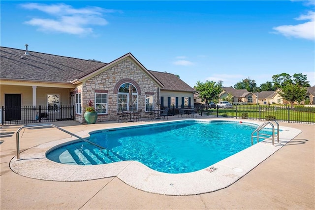 view of swimming pool with a patio