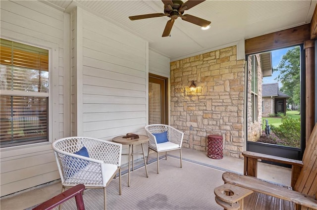 sunroom / solarium with ceiling fan