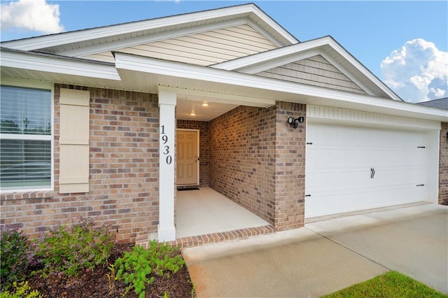 view of exterior entry with a garage