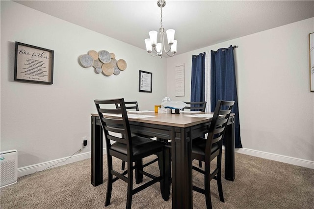 carpeted dining space featuring an inviting chandelier