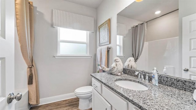 2260 Nadine Ln, Mobile, AL 36695 - full bathroom featuring toilet, a shower with curtain, vanity, wood finished floors, and baseboards