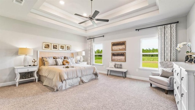 2260 Nadine Ln, Mobile, AL 36695 - bedroom featuring a raised ceiling, light carpet, multiple windows, ornamental molding, and baseboards