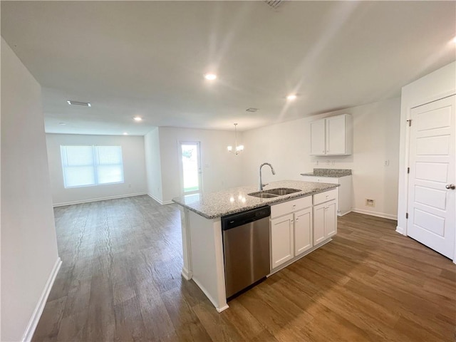 kitchen featuring dishwasher, sink, dark hardwood / wood-style flooring, an island with sink, and white cabinets