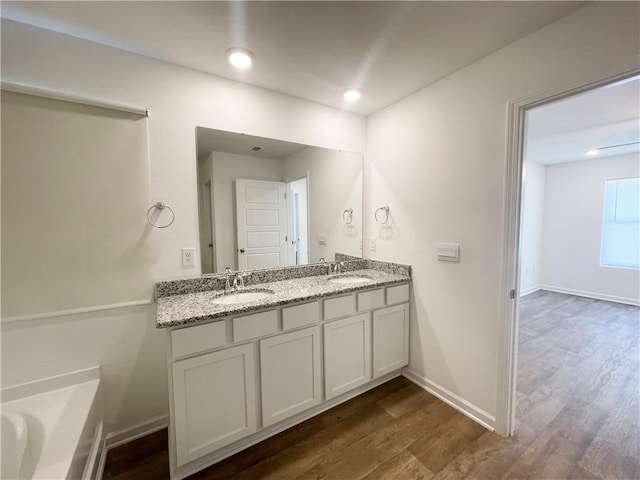 bathroom featuring vanity and wood-type flooring