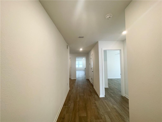 hallway featuring dark hardwood / wood-style floors