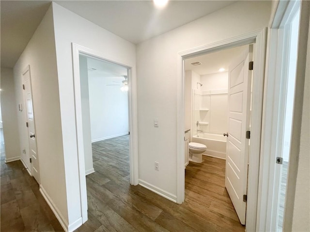 corridor with dark wood-type flooring