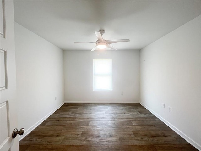 unfurnished room with ceiling fan and dark wood-type flooring