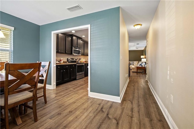 dining space featuring hardwood / wood-style floors