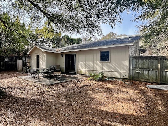 back of property with a patio area